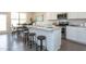 Bright kitchen featuring stainless steel appliances, granite counters, island with seating at 296 Johnson Ridge Way, Four Oaks, NC 27524
