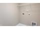 Utility room with white walls, flooring basin, and laundry hookups at 296 Johnson Ridge Way, Four Oaks, NC 27524