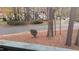 View from condo balcony of a neighborhood street in the fall with leaves on the ground and other buildings in the distance at 311 Ashley Forest Rd # Bldg E, Chapel Hill, NC 27514