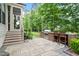 Outdoor kitchen with built-in grill and bar seating, ideal for al fresco dining and entertaining in style at 3160 Mantle Ridge Dr, Apex, NC 27502