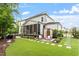 Beautiful backyard featuring a patio, landscaped yard, outdoor sauna, and charming stepping stones at 3160 Mantle Ridge Dr, Apex, NC 27502