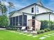 Well-manicured backyard showcasing a patio, outdoor sauna, and lush landscaping at 3160 Mantle Ridge Dr, Apex, NC 27502