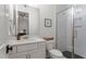Charming bathroom with a single vanity, shower, and stylish fixtures, blending modern design with comfort at 3160 Mantle Ridge Dr, Apex, NC 27502