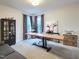 Bright home office featuring a large desk, built-in storage, and natural light, perfect for remote work at 3160 Mantle Ridge Dr, Apex, NC 27502