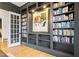 Sophisticated office with custom built-in bookshelves and a unique art piece displayed at 3160 Mantle Ridge Dr, Apex, NC 27502