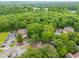 Aerial view of a neighborhood nestled in lush, green woods at 320 Summerwalk Cir, Chapel Hill, NC 27517