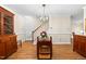 Bright dining area with stylish chandelier and access to the staircase at 320 Summerwalk Cir, Chapel Hill, NC 27517