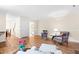 Spacious living area with cozy furniture, hardwood floors, and plenty of natural light at 320 Summerwalk Cir, Chapel Hill, NC 27517