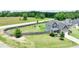 Aerial view showcasing a two-story home, a fenced backyard, and a lush green lawn at 33 Northlodge Ct, Wendell, NC 27591