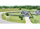 Aerial view of a landscaped property featuring a two-story house, fenced yard, and charming curb appeal at 33 Northlodge Ct, Wendell, NC 27591