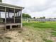 Fenced backyard features a screened porch and lots of play equipment at 33 Northlodge Ct, Wendell, NC 27591