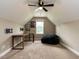 Spacious bonus room under vaulted ceiling with desk, mounted TV, and beanbag chair at 33 Northlodge Ct, Wendell, NC 27591