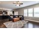 Bright and open living area connecting to the kitchen, featuring hardwood floors and ample natural light at 33 Northlodge Ct, Wendell, NC 27591