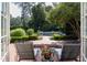 Backyard view with swimming pool, lounge chairs, patio, and lush landscaping at 3307 Devon Rd, Durham, NC 27707