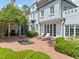 Charming backyard with a brick patio, lounge chairs, and lush greenery, perfect for outdoor relaxation at 3307 Devon Rd, Durham, NC 27707