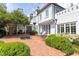 Brick patio featuring outdoor fireplace, seating, and a fountain at 3307 Devon Rd, Durham, NC 27707