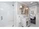 Bright bathroom featuring a glass shower, white vanity, and access to the main bedroom at 3307 Devon Rd, Durham, NC 27707