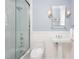 Bathroom featuring a glass shower, pedestal sink, and wainscoting at 3307 Devon Rd, Durham, NC 27707