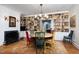 Dining area with fireplace, shelving and colorful chairs at 3307 Devon Rd, Durham, NC 27707