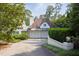 Charming home with a private driveway, three-car garage, and lush landscaping at 3307 Devon Rd, Durham, NC 27707