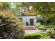 Charming white brick home with a meticulously landscaped front yard and a welcoming brick-step entryway at 3307 Devon Rd, Durham, NC 27707