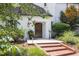 Inviting front entrance with brick steps, manicured landscaping, and charming details creating a warm welcome at 3307 Devon Rd, Durham, NC 27707