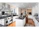 Modern kitchen with stainless steel appliances, black countertops, and a central island at 3307 Devon Rd, Durham, NC 27707
