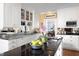 Bright kitchen featuring stainless steel counters, sleek cabinetry and modern appliances at 3307 Devon Rd, Durham, NC 27707