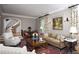 Comfortable living room with a cozy seating arrangement, a large rug, and elegant decor details at 3307 Devon Rd, Durham, NC 27707
