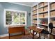Bright office features a bay window, hardwood floors, custom shelving, and a dedicated art table at 3307 Devon Rd, Durham, NC 27707