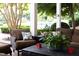Inviting patio features comfortable seating with cushions and pillows, and decorative plants at 3307 Devon Rd, Durham, NC 27707