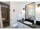 Bathroom features tiled shower with glass door and updated vanity at 3317 E Jameson Rd, Raleigh, NC 27604