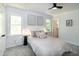 Bedroom features ceiling fan, neutral color scheme, and natural light at 3317 E Jameson Rd, Raleigh, NC 27604