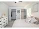 Bedroom featuring double closets, ceiling fan, and neutral color scheme at 3317 E Jameson Rd, Raleigh, NC 27604