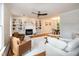 Bright and inviting living room with hardwood floors, white fireplace, open floor plan, and plenty of natural light at 3317 E Jameson Rd, Raleigh, NC 27604