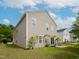 Large backyard featuring mature lawn, patio, mature trees and rear entrance at 3515 Mountain Brook Cir, Durham, NC 27704