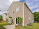 Inviting backyard features a concrete patio, healthy lawn and mature landscaping at 3515 Mountain Brook Cir, Durham, NC 27704