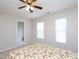 Neutral bedroom with a ceiling fan, carpeting and windows at 3515 Mountain Brook Cir, Durham, NC 27704