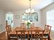 Charming dining area with hardwood floors, arched openings, and abundant natural light at 3515 Mountain Brook Cir, Durham, NC 27704