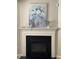Elegant fireplace with a decorative mantel creating a cozy focal point in the living space at 3515 Mountain Brook Cir, Durham, NC 27704