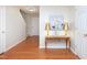 Welcoming foyer with hardwood floors, a decorative table, and a view of the staircase at 3515 Mountain Brook Cir, Durham, NC 27704