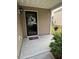 Inviting covered porch with decorative wreath, perfect for greeting guests at 3515 Mountain Brook Cir, Durham, NC 27704