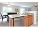 Modern kitchen with stainless steel appliances, granite countertops, and an adjacent dining area for easy entertaining at 3515 Mountain Brook Cir, Durham, NC 27704