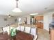 Open floor plan featuring the kitchen with stainless steel appliances and island adjacent to the living room at 3515 Mountain Brook Cir, Durham, NC 27704
