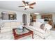 Relaxing living room with plush sofas, a ceiling fan, and an open layout connecting to the kitchen at 3515 Mountain Brook Cir, Durham, NC 27704