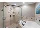 Updated bathroom with a tub and shower, modern fixtures, and tiled walls at 3720 Jamestown Cir, Raleigh, NC 27609