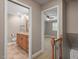 Upstairs hallway providing views of the bathroom and bedroom with carpet floors at 3720 Jamestown Cir, Raleigh, NC 27609