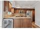 Well-lit kitchen with stainless steel appliances, granite countertops, and custom wood cabinetry at 3720 Jamestown Cir, Raleigh, NC 27609