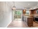 Spacious kitchen features stainless appliances, granite countertops, and a view of the backyard at 3720 Jamestown Cir, Raleigh, NC 27609
