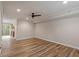 Spacious living room with hardwood floors, slider to backyard, and open floor plan at 3720 Jamestown Cir, Raleigh, NC 27609